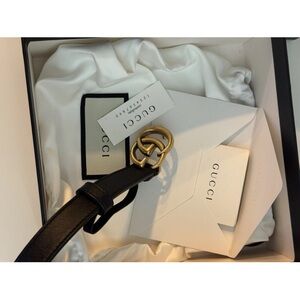 Gucci women’s black belt size 70 with Gold Interlocking G Buckle